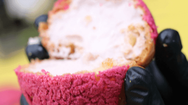Splitting cream-filled bread by hand
