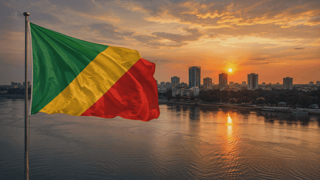 Republic of Congo flag and city skyline at sunset