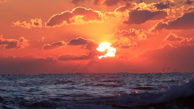 Red Sunset Over the Ocean Horizon