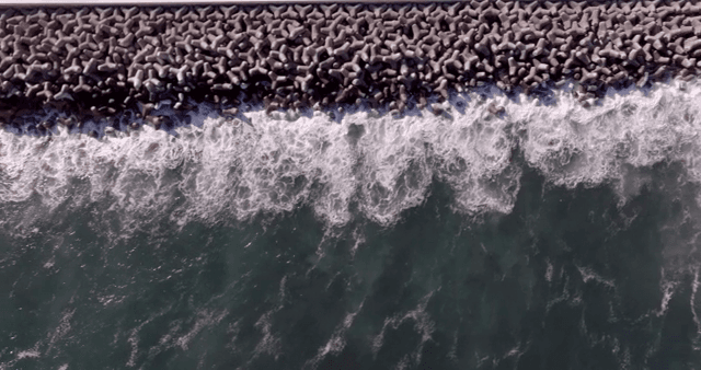 Waves crashing against a breakwater