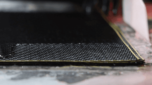 Applying resin to carbon fiber sheets is squeeze