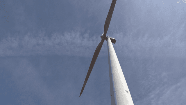 Wind turbines in sky landscape