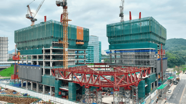 Construction site with cranes and buildings