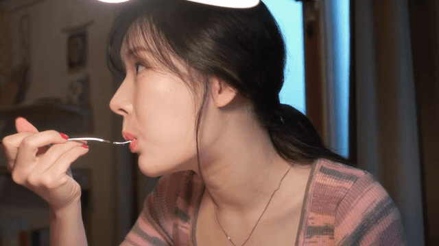 Woman enjoying a meal indoors