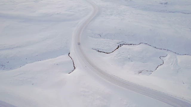 Car driving on a snowy road