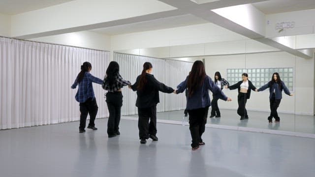 K-POP Dancers Practicing in a Studio