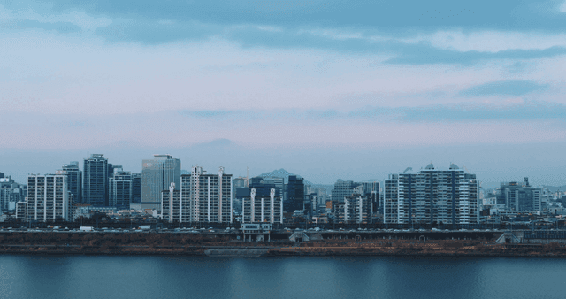 City skyline with a river in the foreground
