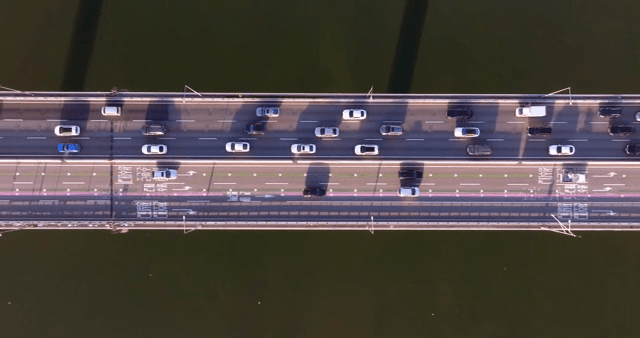 Cars moving on a bridge over a river
