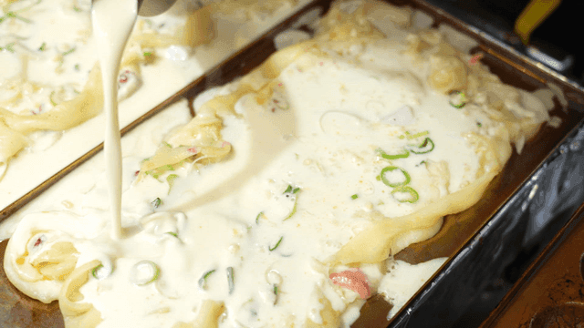 Takoyaki batter poured into hot mold