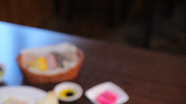 Table set with a creamy pasta dish and appetizer bread