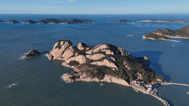 A scenic island surrounded by blue sea