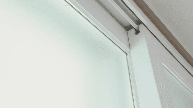 Close-up of a frosted glass window indoors