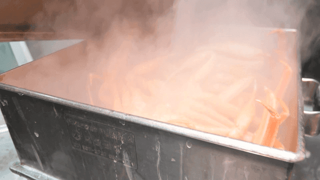 Steamed snow crab in metal steamer