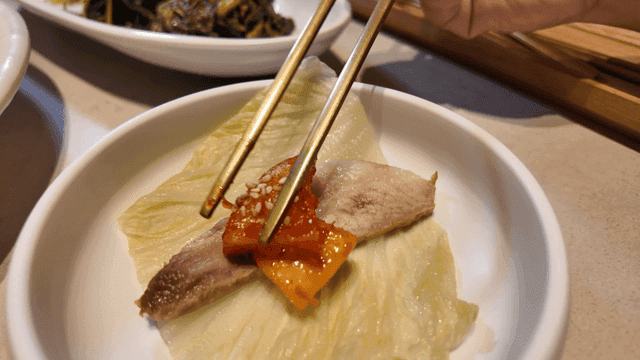 Korean side dishes and pork with kimchi