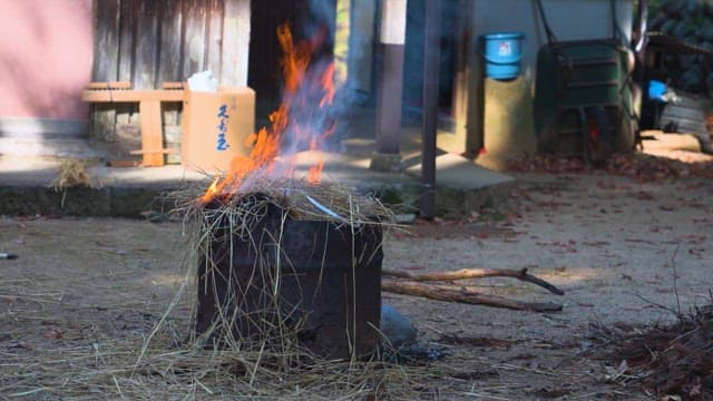 Fire in a Traditional Iron Incinerator in a Rural House