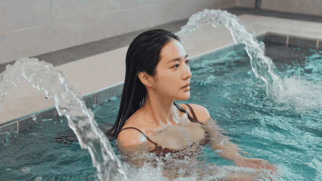 Woman relaxing in spa pool