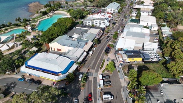 Road in a coastal city with a swimming pool