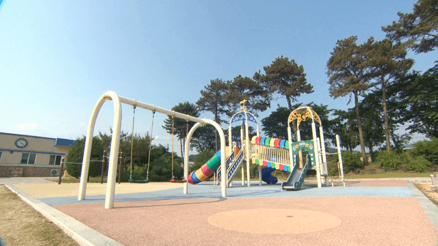 Empty playground under a clear blue sky