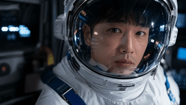 Astronaut in a spacecraft cockpit