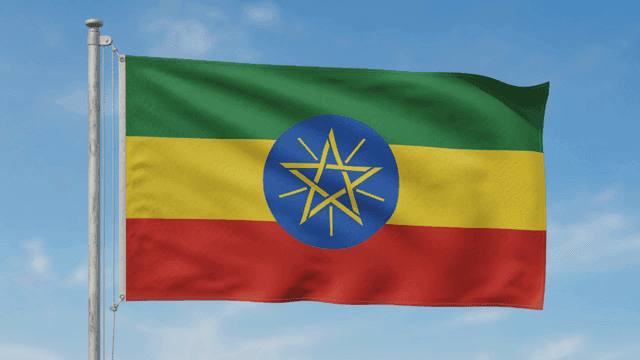 Ethiopian flag waving against a clear sky