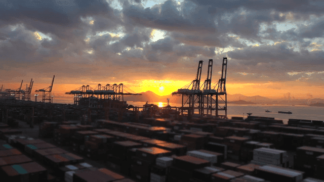 Sunset over a busy cargo port