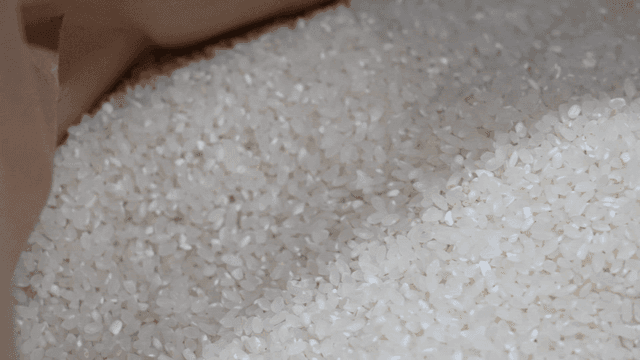 Rice sack filled with white rice grains