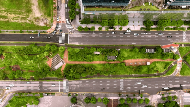 Aerial view of a city intersection with greenery