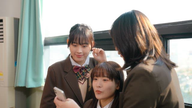 Students taking a selfie in a classroom