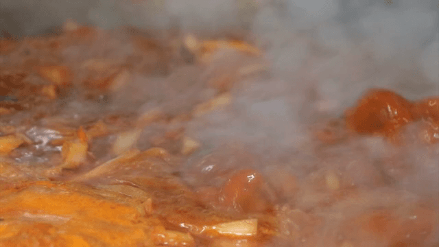 Spicy seafood soup boiling in a pot
