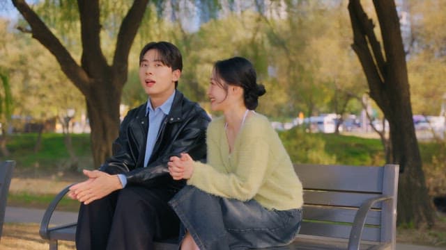 Couple talking on a park bench