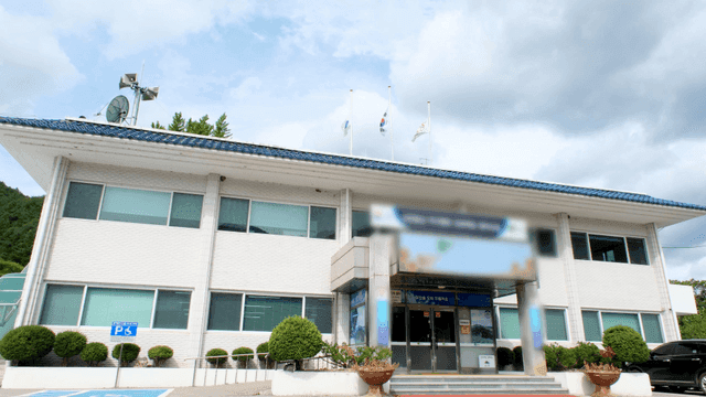 Government office with flag on top of building