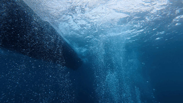 Underwater with bubbles and waves