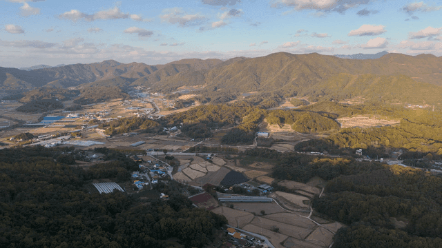 Aerial view of rural farmland and mountains