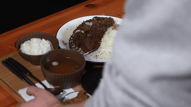Tray with rice and black pork cutlet