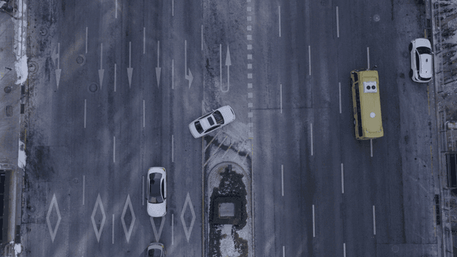 Aerial view of main road where cars pass by