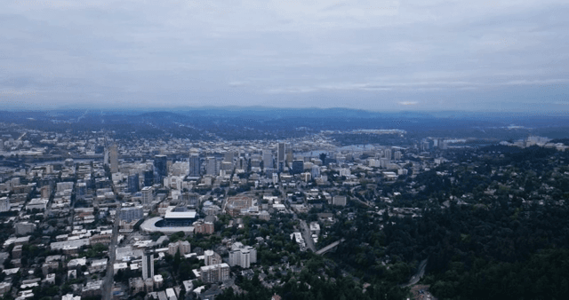 A sprawling cityscape under a cloudy sky