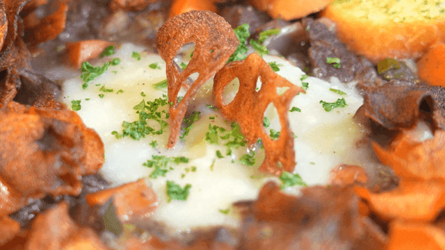 Beef Bourguignon with herbs and crispy chips