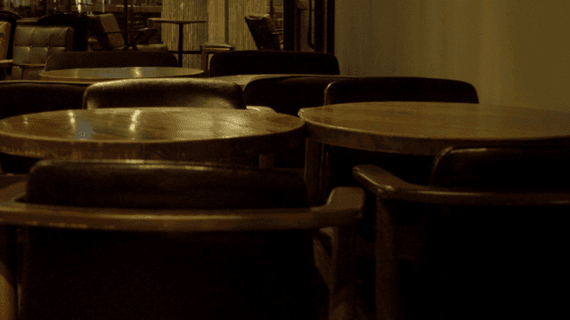 Empty cafe with wooden tables and chairs