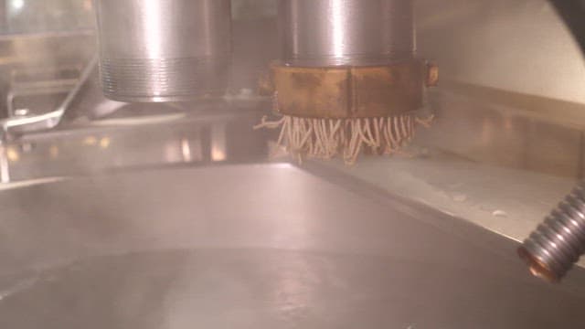 Buckwheat noodles coming out of the machine