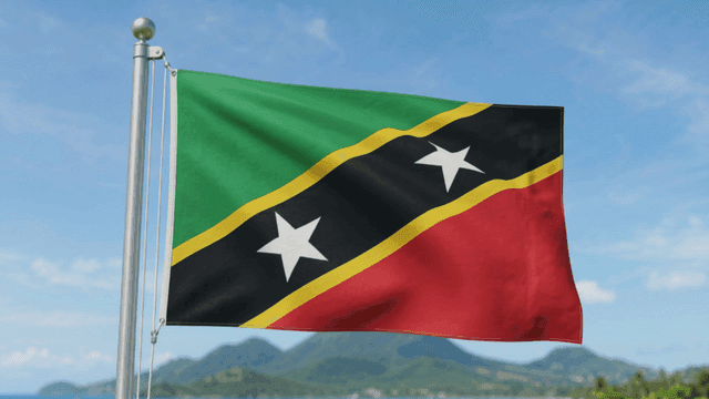Saint Kitts and Nevis flag with mountain in background
