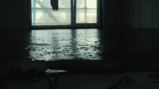 Concrete floor being poured indoors