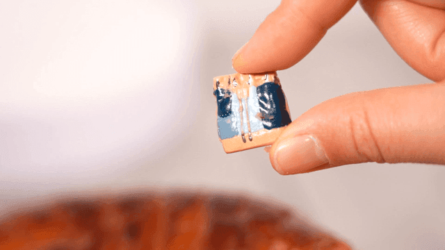 Doll stuck between slices of cake