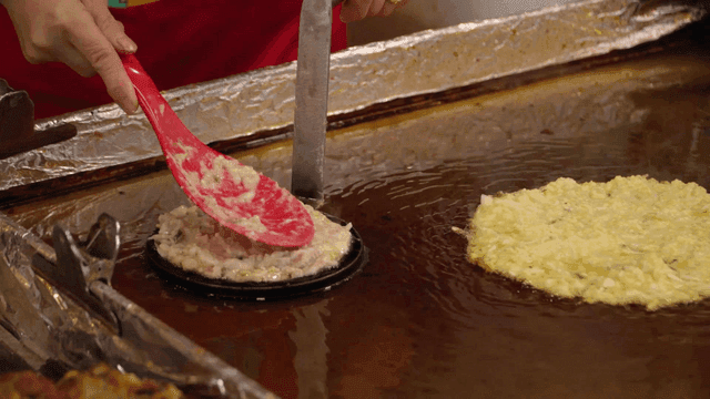Mung bean pancakes on hot iron plate