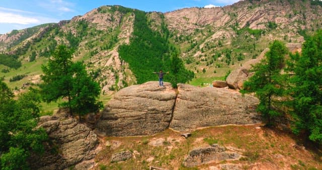 Person standing on a rocky mountain