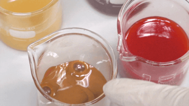 Various colored liquids in beakers