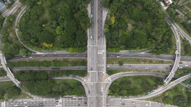 Overhead View of Urban Green Space and Traffic Intersection