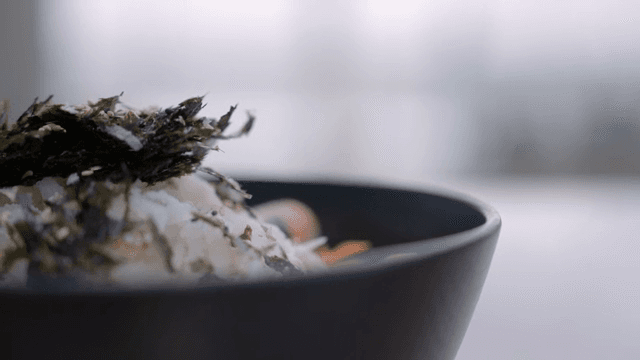 Fresh Raw Fish Bibimbap topped with seaweed and seafood