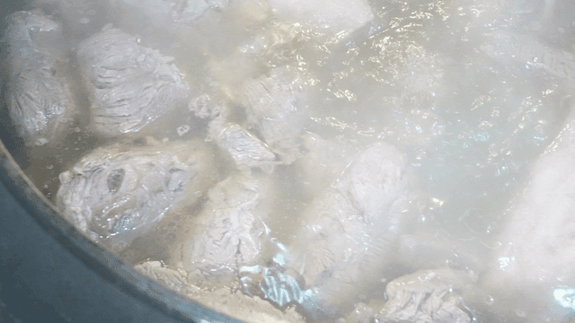 Meat boiling in a pot