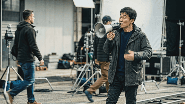 Film director giving instructions on set