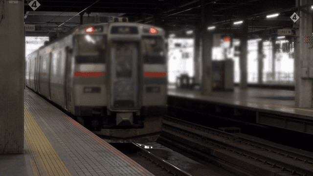A train departing from a station platform